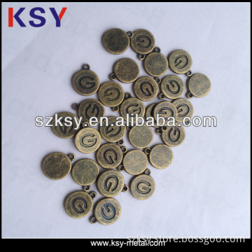 Engraved small bulk metal charm